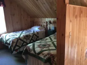 Quiet secluded log cabin; the cabin is part of a 37 acre waterfront complex. - Image 4