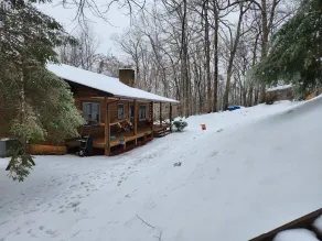 Unwind in Seclusion: Log Cabin Retreat with Wood Burning Stove & Game Table - Image 4