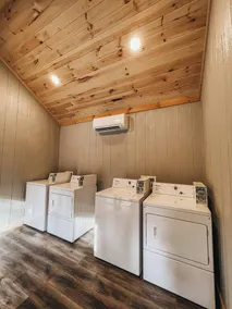 Cabin #9: One king-size bed, a kitchenette, and a large gravel parking pad beside the cabin for easy boat or trailer storage. - Image 4