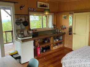 Cozy wooden cabin with a covered terrace and a panoramic view - Image 5