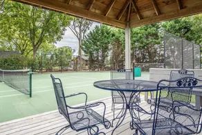 Waterfront home with swimming pool and tennis court. - Image 3