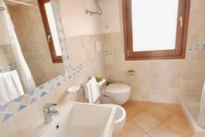 Studio apartment for 2 people of 27 m2 furnished in Sardinian style.Located on the ground floor with veranda and small garden or first floor with balcony.Composed of living room with kitchenette, 2 joinable single beds, bathroom.Endowed of:- TV- air cond - Image 2