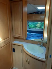 Spacious caravan with fixed awning and sheltered garden - Image 3