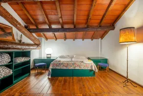 GuestHost - This apartment is located on the top floor of a country villaCharacterized by large spaces including an inviting very bright living room thanks to large windows, a kitchen and a large bedroom accessible via a spiral staircaseAmong the common  - Image 4