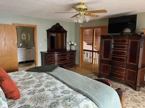 Waterfront retreat on 7 private wooded acres with beautiful sunset views. - Image 4