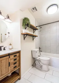 This centrally located 3 bedroom 2 bathroom features a full size pool and electric vehicle charging on site. - Image 3