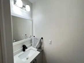 One bedroom ensuite toilet on main level & kitchen, living, bathroom lower level - Image 4