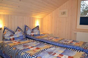 Child-friendly vacation home \"Kuschelmuschel 14\" in Baabe. A relaxing getaway with a sauna and hot tub, a washing machine, a furnished patio, and just about 150 meters from the beach. - Image 4