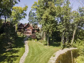 Log Cabin Mansion fronting Strawberry and Bass Lake with large oversized suites. - Image 4