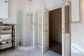 GuestHost - This apartment is located on the top floor of a country villaCharacterized by large spaces including an inviting very bright living room thanks to large windows, a kitchen and a large bedroom accessible via a spiral staircaseAmong the common  - Image 3