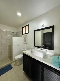 Rooftop Sunset Cove, This spacious and sunlit apartment features 2 bedrooms, 1.5 bathrooms, a stunning rooftop terrace - Image 5