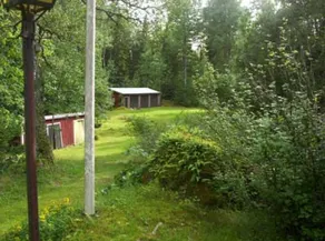 Red and white cottage with a boat not far from the lake - Image 5