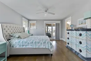 Spacious deck has ocean views as home is across the street from the beachblock. - Image 5