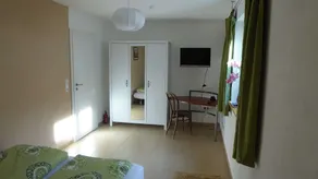 Room with private bathroom in detached house - Image 5