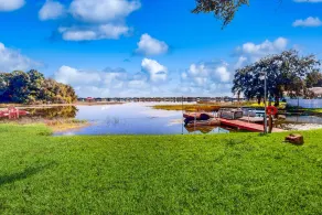 Lakefront home with water views, foosball, screened porch, & private W/D - Image 2