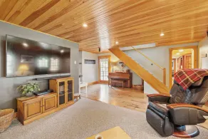 Central Escape is a spacious Lakes Region retreat just 5 minutes from downtown Meredith, less than a mile to Squam Lake and 20 minutes to concerts at the Bank of New Hampshire Pavilion. Enjoy the private year-round hot tub, fire pit, yard games! - Image 2