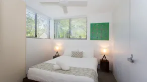 Relax by the pool whilst enjoying the landscaped garden and Laguna Bay views - Image 4