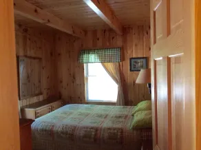 Quiet secluded log cabin; the cabin is part of a 37 acre waterfront complex. - Image 3