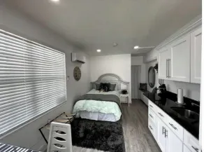 Modern studio apartment with covered outside seating area - Image 3