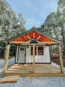 Cabin #9: One king-size bed, a kitchenette, and a large gravel parking pad beside the cabin for easy boat or trailer storage. - Image 5