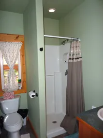 Glamping at its finest in an adorable tiny home cabin that sleeps up to three! Shared hot tub. Beautiful property surrounding the cabin. Short stroll to Copper Creek. Walking distance to Copper Creek Restaurant. 2 miles to Mt Rainier National Park. - Image 3