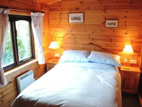Pine log cabin situated in an ideal location for the outdoor enthusiast. - Image 4