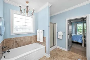 Bring the whole crew to Rest & Reel! This 4BR/2BA Fish River cottage sleeps 12 and offers great fishing, a private pier, boat watching, and a game table for family fun. Relax, reel one in, and make memories! - Image 4