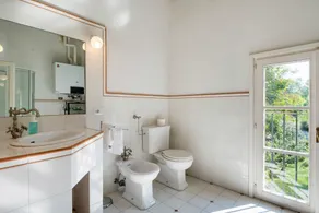 GuestHost - This apartment is located on the top floor of a country villaCharacterized by large spaces including an inviting very bright living room thanks to large windows, a kitchen and a large bedroom accessible via a spiral staircaseAmong the common  - Image 2