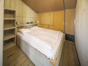 Experience luxury glamping in the elevated Safari Tent Ranger by the water. - Image 4
