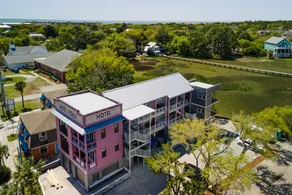 Boutique Hotel Folly Room 5: King Deluxe Studio - cozy porch views of the Folly River ADA - Image 2