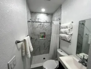 Modern studio apartment with covered outside seating area - Image 2