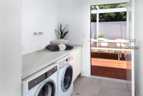 Our beachside home offers the perfect mix of coastal charm and modern living! - Image 2