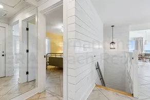 Spacious living area, windows across entire length of home. - Image 3