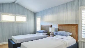 This home matches quaint beachside charm with luxurious comfort. - Image 2