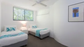 Relax by the pool whilst enjoying the landscaped garden and Laguna Bay views - Image 5
