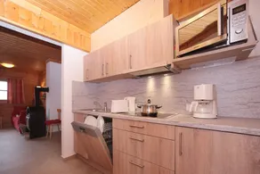 Staudi's ski hut vacation apartment Top1 in hut style directly on the slopes Stove - Image 4