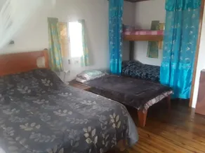 Set in jungle, Wild Orchid is a self catering 2 bedroom cabin with private porch - Image 3
