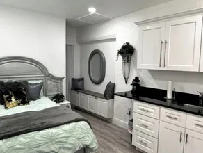 Modern studio apartment with covered outside seating area - Image 4