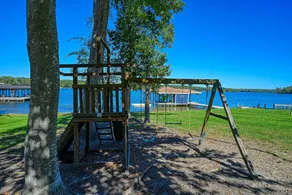 Lakefront home with private hot tub, WiFi, fun rec room, & beach area - Image 3