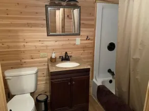 Peaceful cabin in secluded mountain spot beside a picturesque creek - Image 2