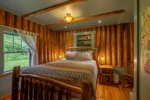 This historic cabin is just a few miles from Mt Rainier National Park. Pet friendly. Fish pond, pastures, old cedars, 11-acres. Private hot tub surrounded by grove of old cedars. - Image 5