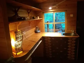 a hidden hut with a terrace overlooking the forest - Image 5