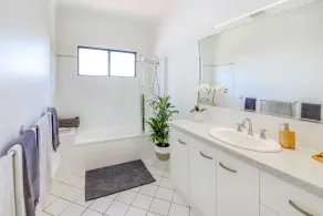 Our beachside home offers the perfect mix of coastal charm and modern living! - Image 4