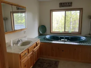 Lake cabin on 5 acres and 780' of shoreline on an island with panoramic views. - Image 4