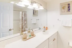 Second-floor condo with full kitchen, washer/dryer, central AC, & boat slip use - Image 2