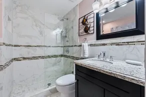 Beautifully renovated top floor condo with lake view, minutes from the beach - Image 3