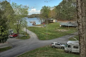 Holiday House (Sleeps 1-12) - Offer a 4-bedroom, 2-bath unit with 1 queen, 3 full, 4 twin beds, and a pull-out sofa. - Image 2