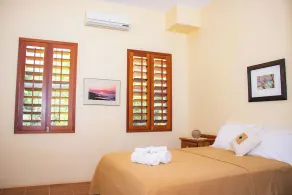 Queen-size bed, with a private bathroom, a walk-in shower and closet. - Image 2