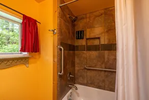 This historic cabin is just a few miles from Mt Rainier National Park. Pet friendly. Fish pond, pastures, old cedars, 11-acres. Private hot tub surrounded by grove of old cedars. - Image 3
