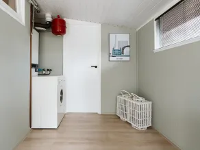 The holiday home boasts a delightful garden and modern interior for a carefree vacation close to the sea and dunes. - Image 2
